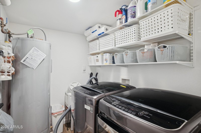 Inside laundry with storage
