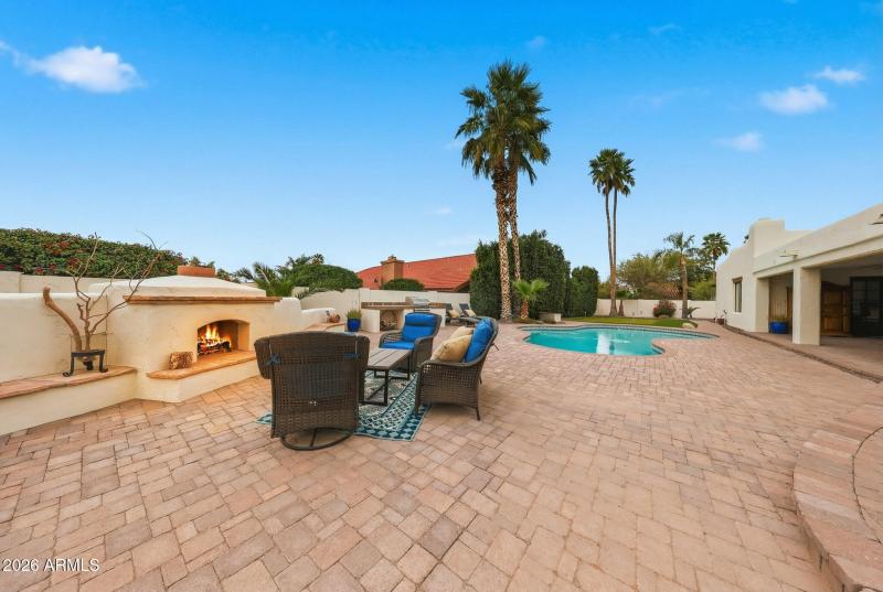 Sitting area with view of house & pool