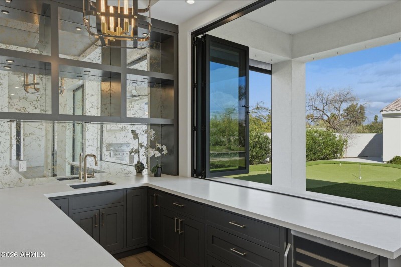 Media Bar Opens to Outdoor Patio