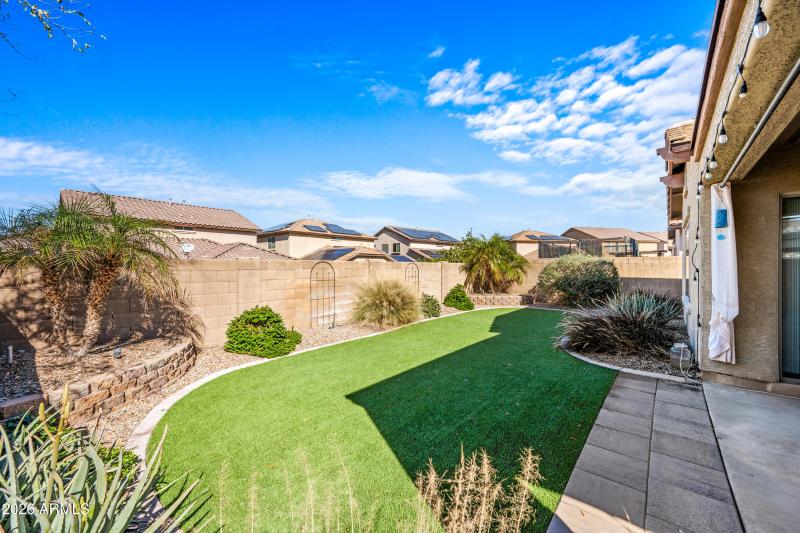 Synthetic low maintenance grass backyard