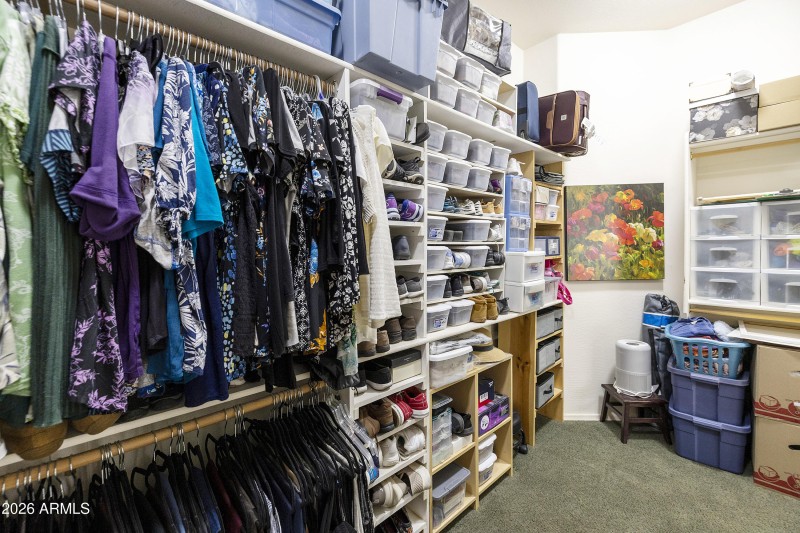 Walk through closet in primary bathroom