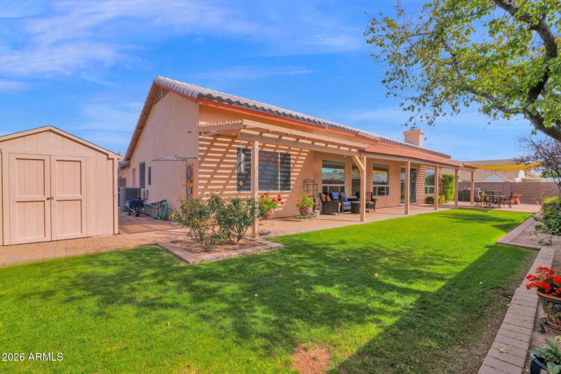 Back grass and storage shed