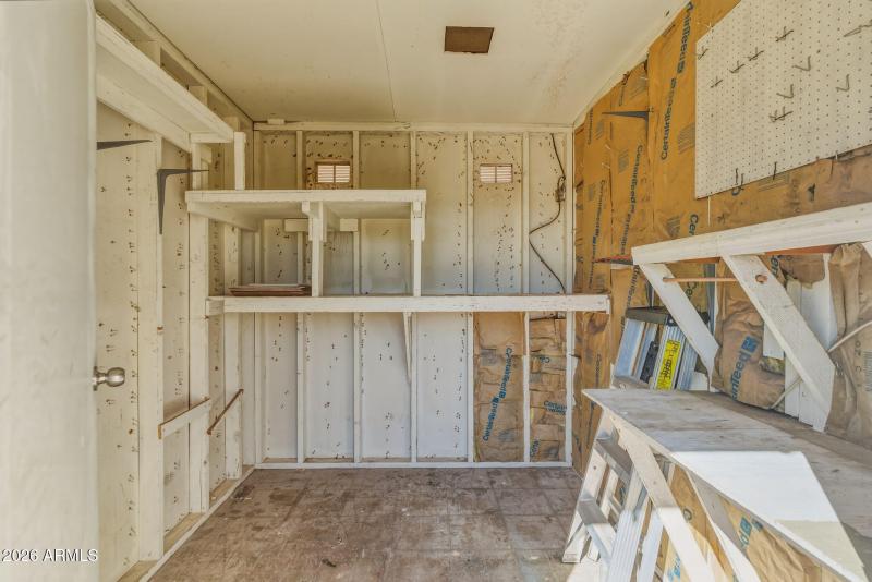 Workroom behind carport
