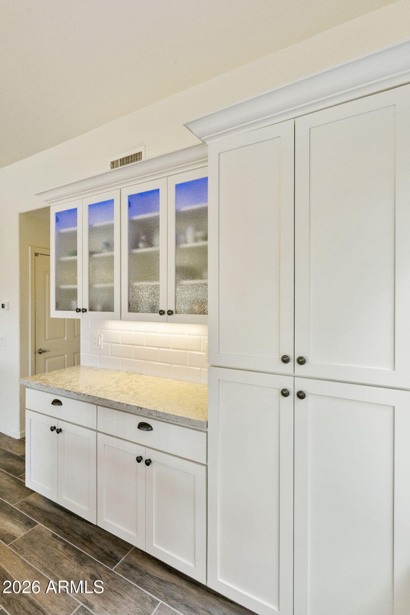 Kitchen with glass door cabinets