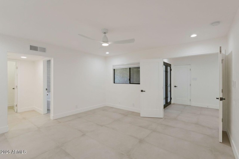 Primary suite situated privately.