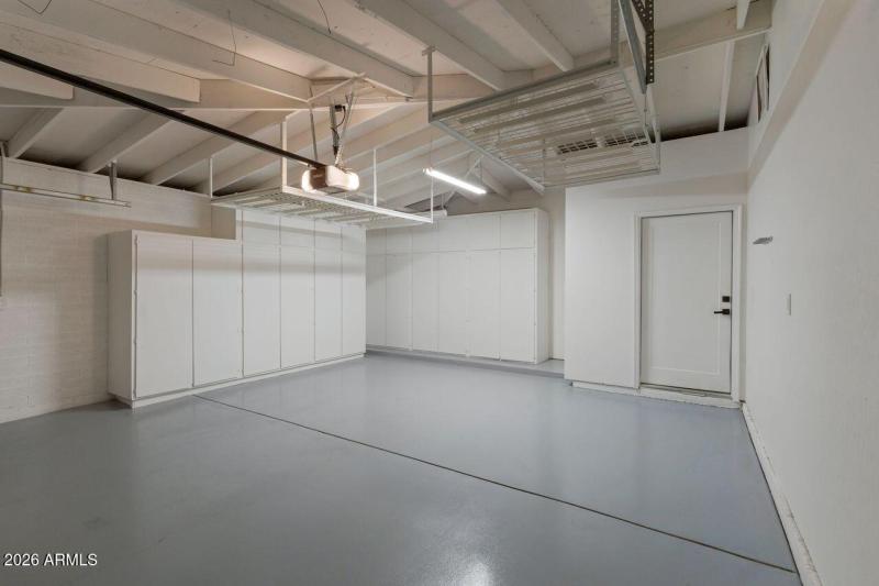 Garage offers extensive storage.