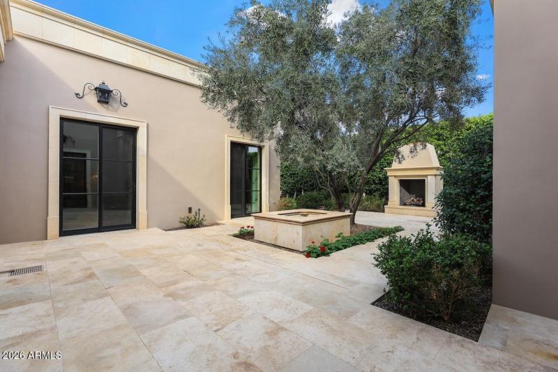 #75 back courtyard to fireplace