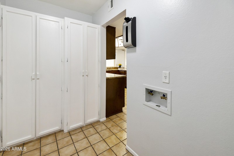 Laundry room w/storage cabinets