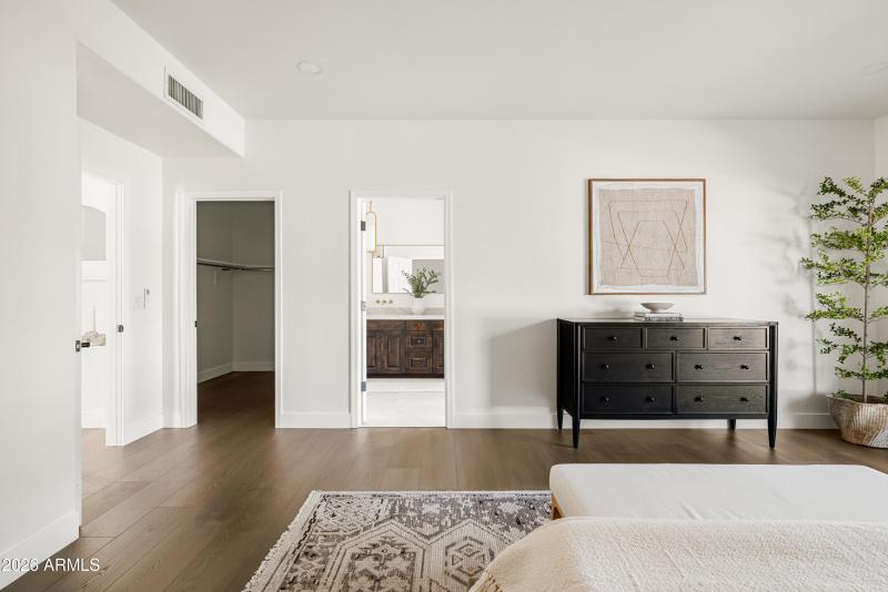 Primary bedroom into walk-in closet