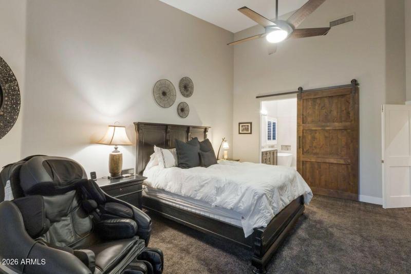 Primary suite new barn door to bath.