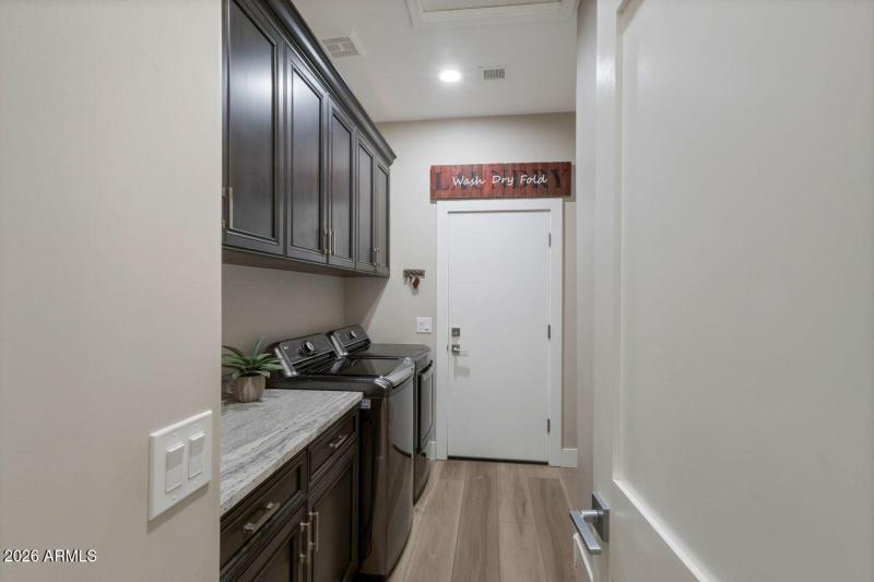 Laundry room to Garage for owner access.