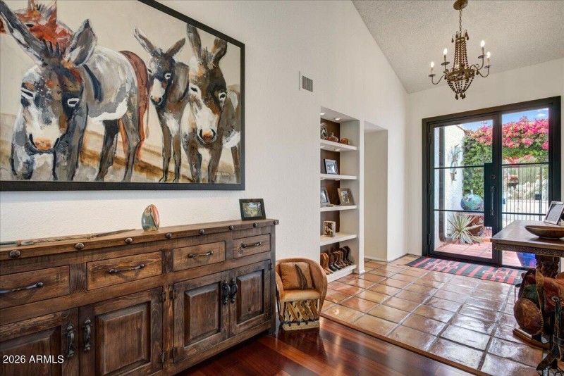 Foyer with Custom iron entry door