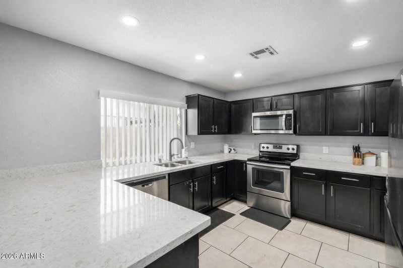 Modern kitchen with sleek stainless acce