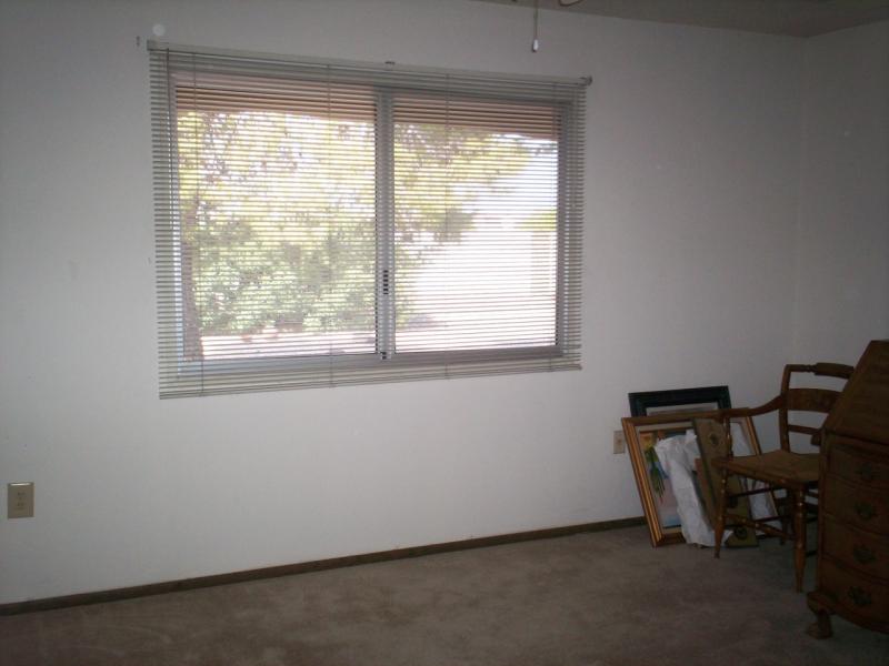 master bedroom w/ view to back yard