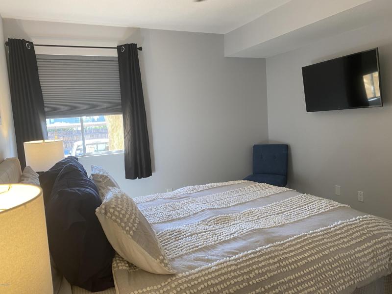 Bedroom with large TV