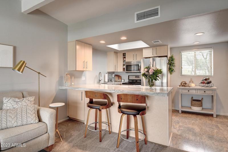 Kitchen w/Bar Seating & Skylight
