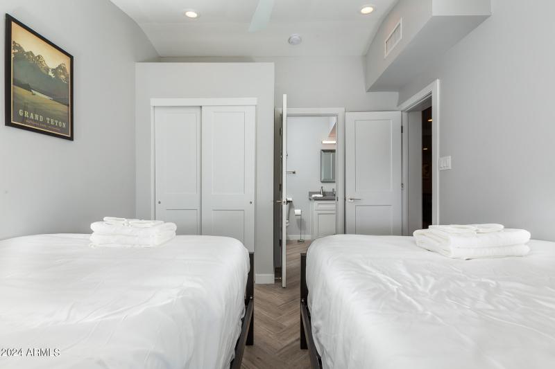 Bedroom-With-Two-Beds-and-Bathroom