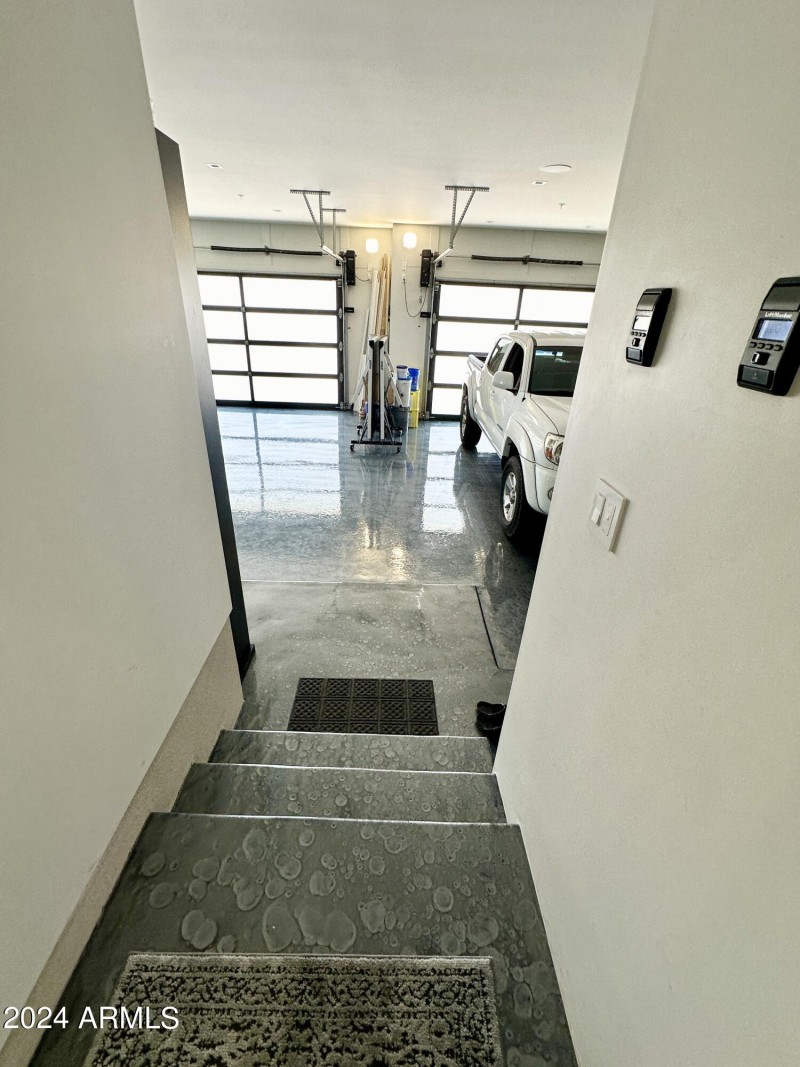 Steps down into garage