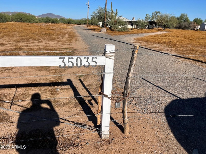 Entry to property with paved driveway