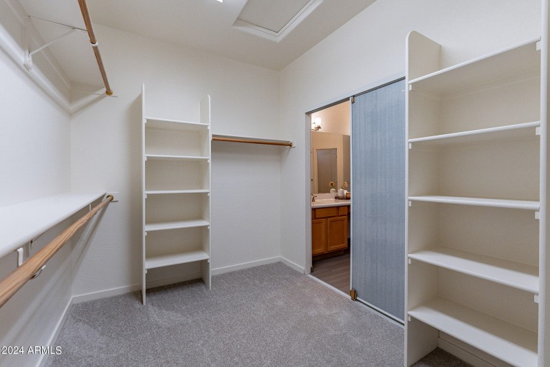 Primary closet with built in shelves
