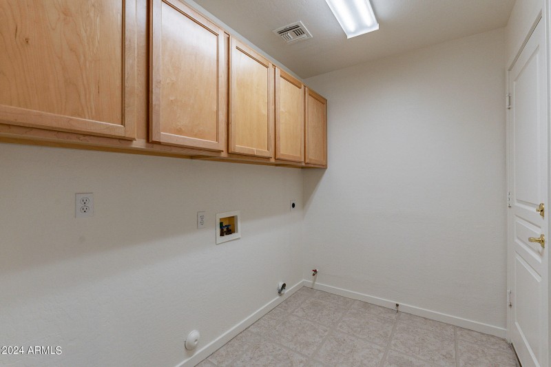 Laundry room with cabinets