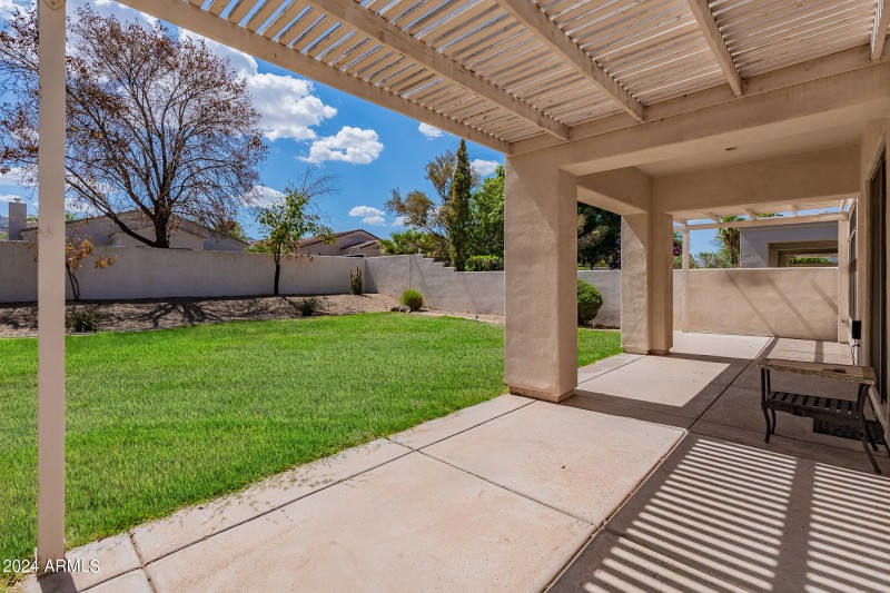 Large yard with extended covered patio