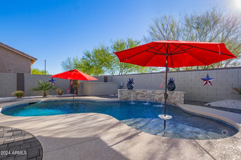 Pool with water feature and Baja shelf