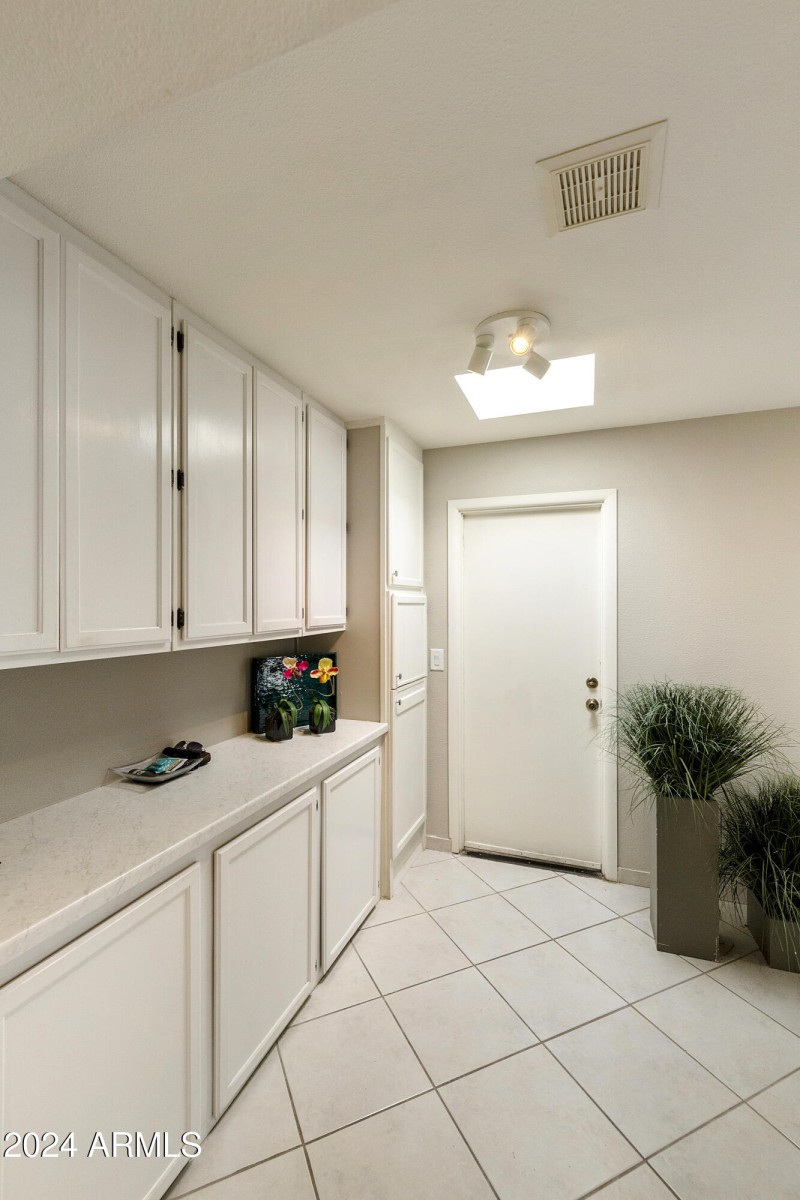 Cabinet storage off garage entry