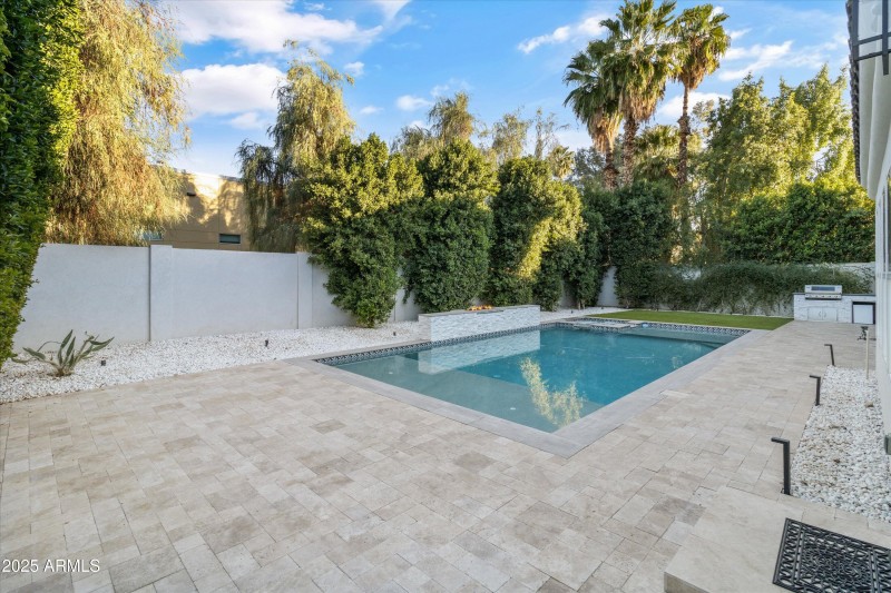high-end travertine pool deck