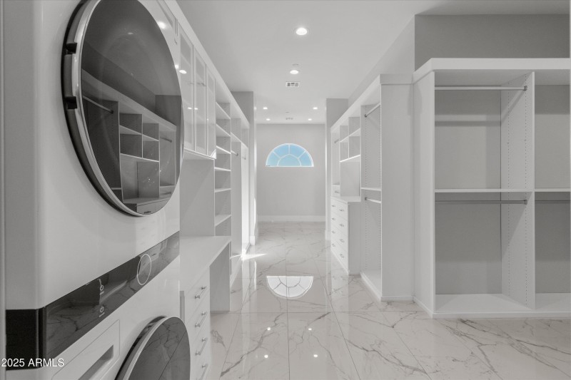 Massive walk-in closet with fine details