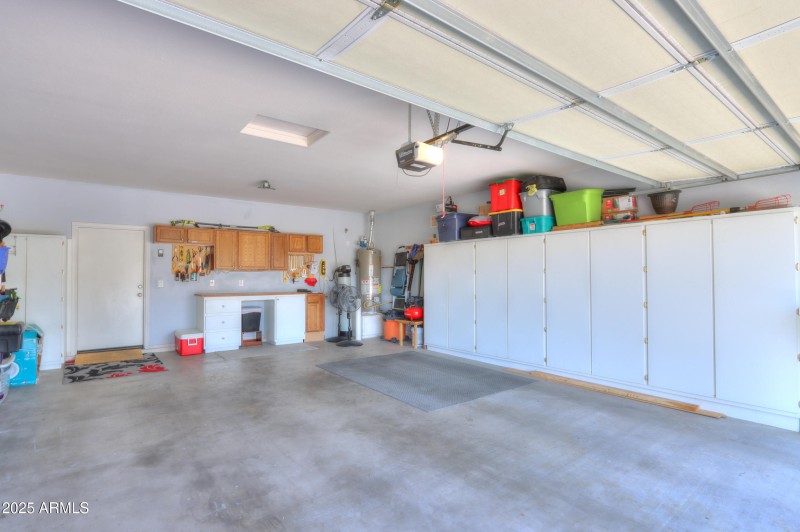 Oversided garage with cabinets