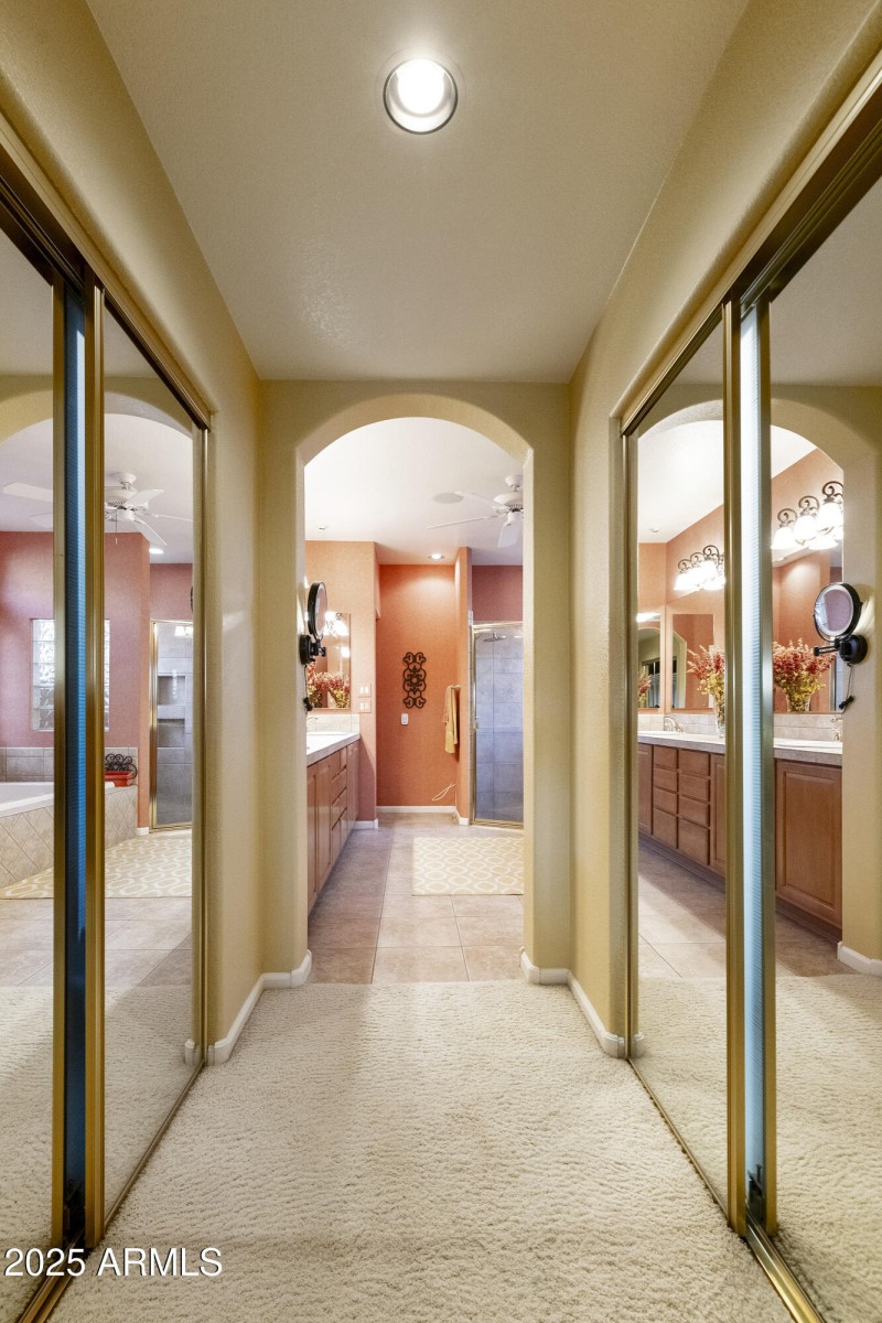 Closet walkway to Primary Suite bathroom