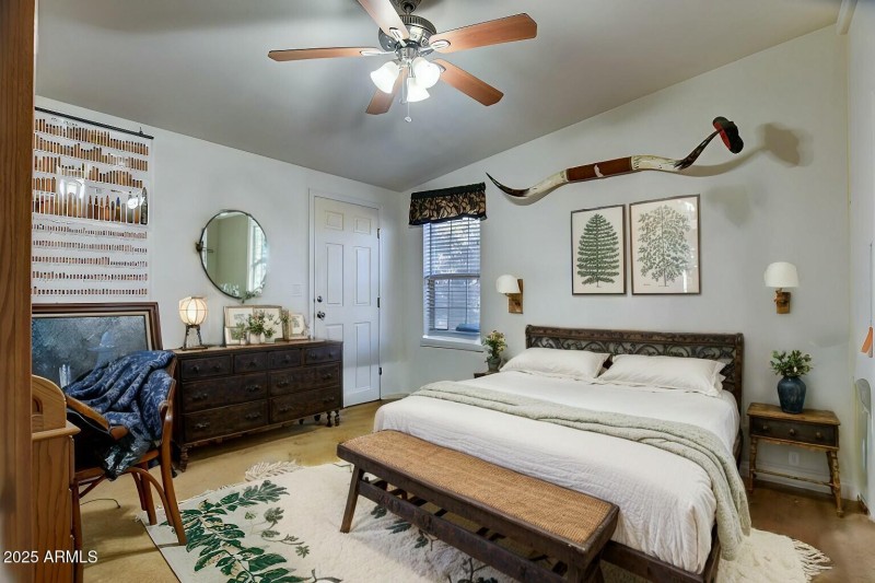 Primary bedroom with door to front porch