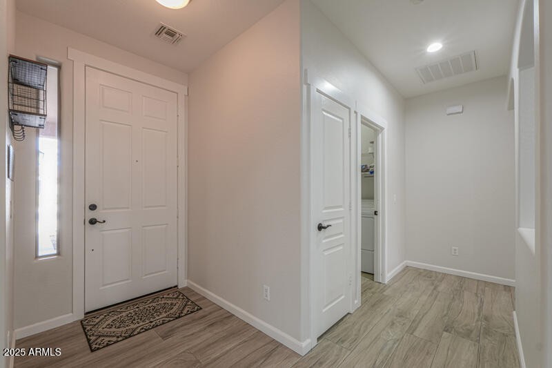 Foyer, coat closet & laundry