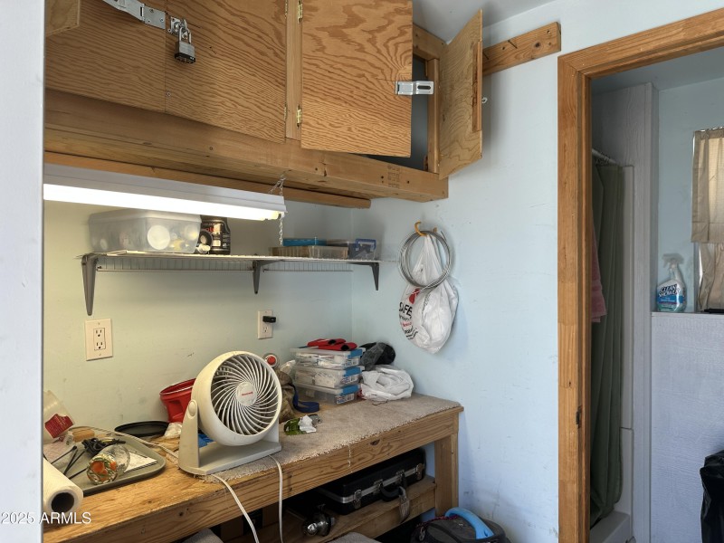 Workbench in shed see little room beyond