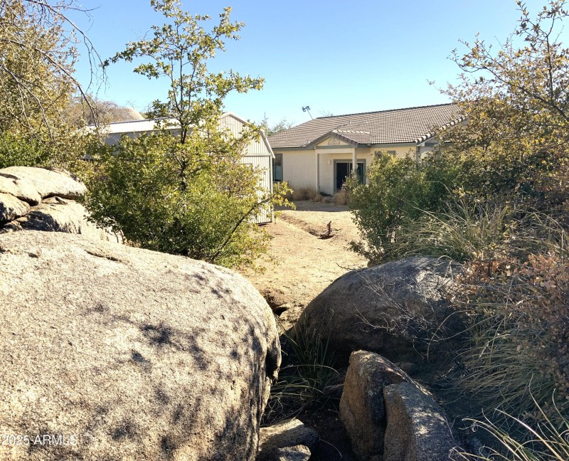 view of back of house from arroyo