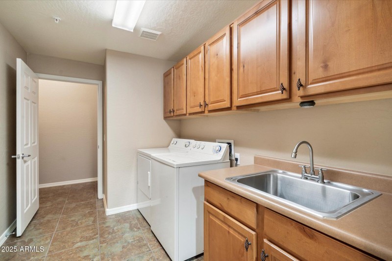 laundry room with additional storage