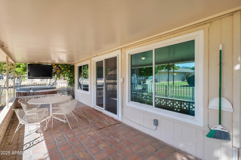 covered patio, spa and TV