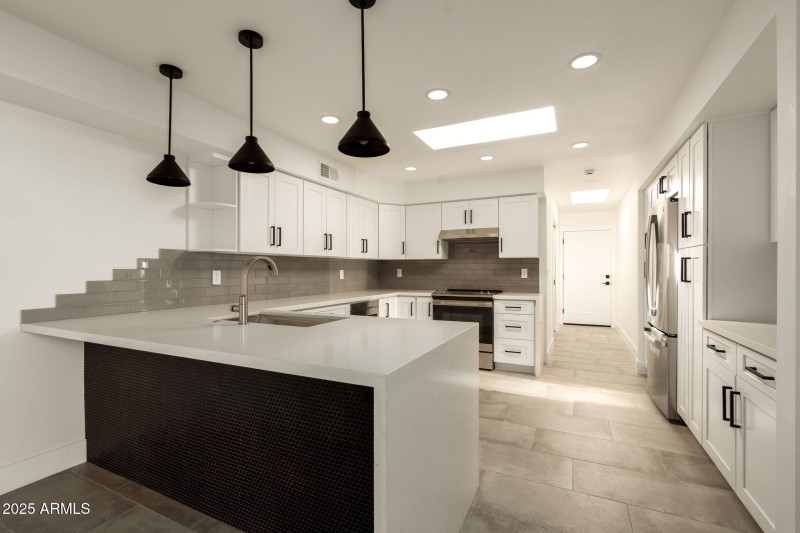 Kitchen with Sleek Waterfall Countertops