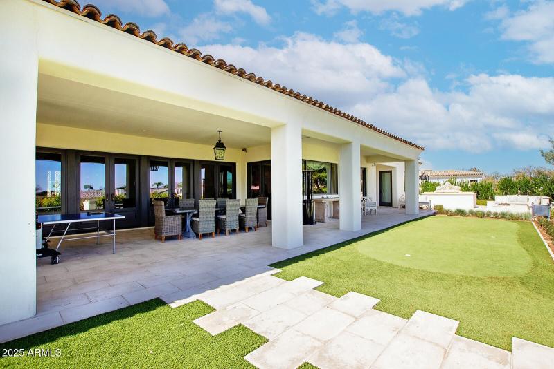 covered atio overlooks immaculate greens