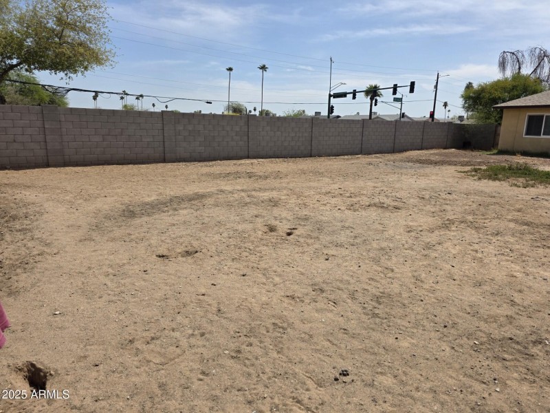 Encanto Block wall with large yard