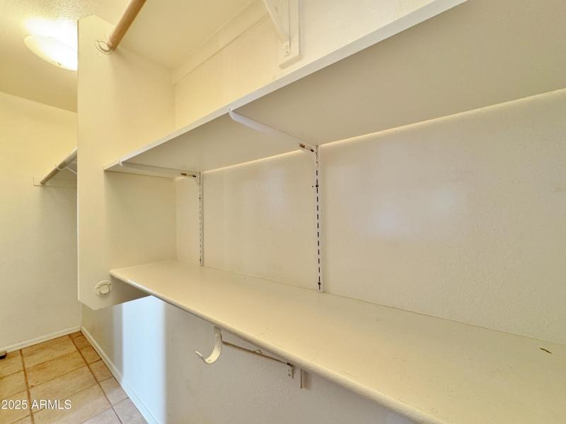 Lighted storage & closet space in hall