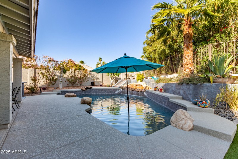 Separate pool and grassy play area