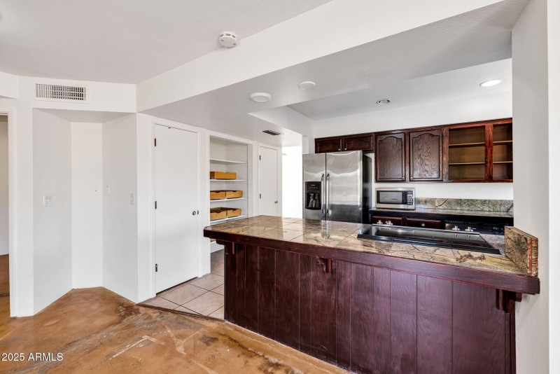 Kitchen view of open pantry