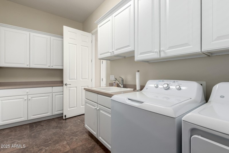 Large Laundry Room with Cabinets
