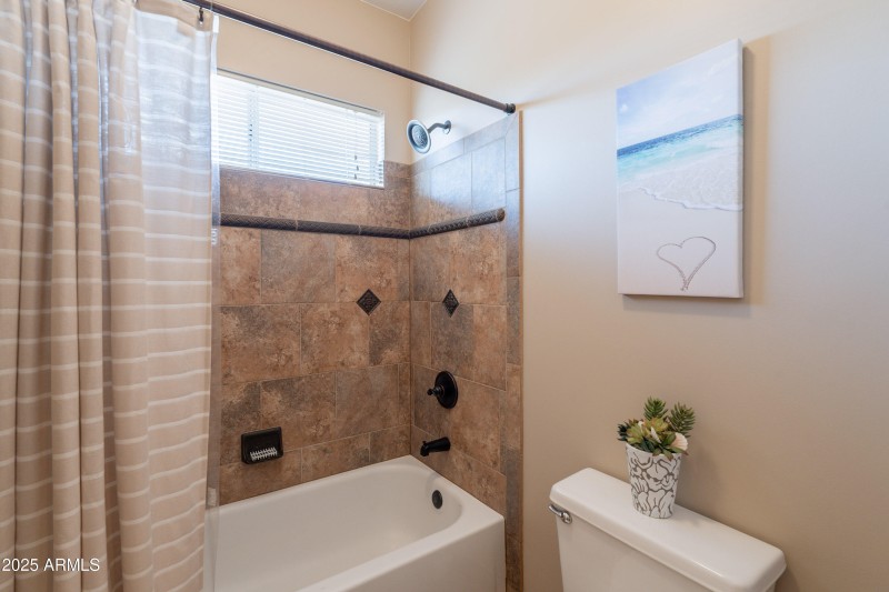 Tiled shower upstairs hall bath.