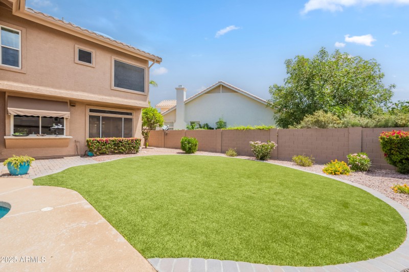 Artificial grass and pavers.