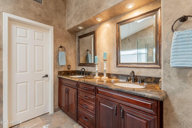 Raised vanity with double sinks.