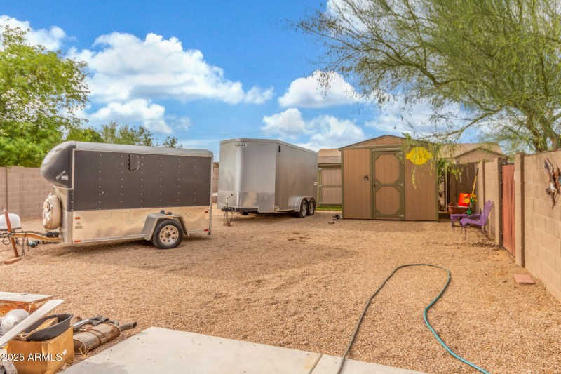 RV parking space with storage shed
