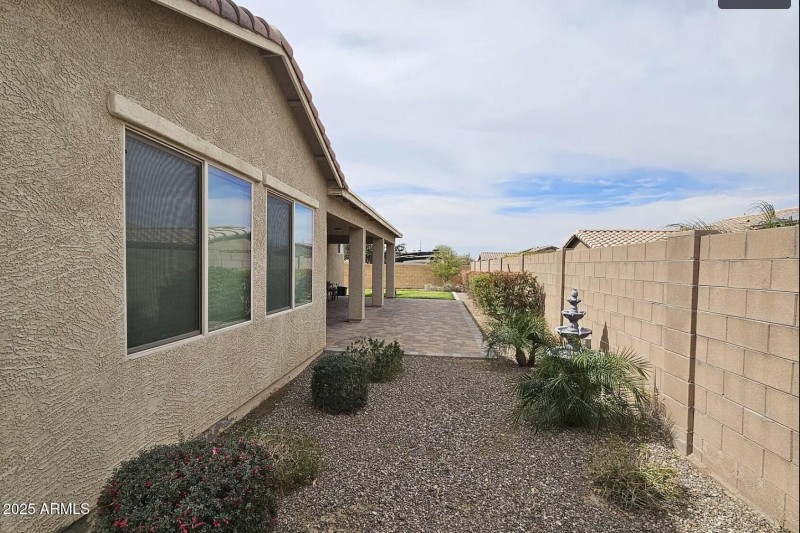 Spacious side yard adds a nice buffer.